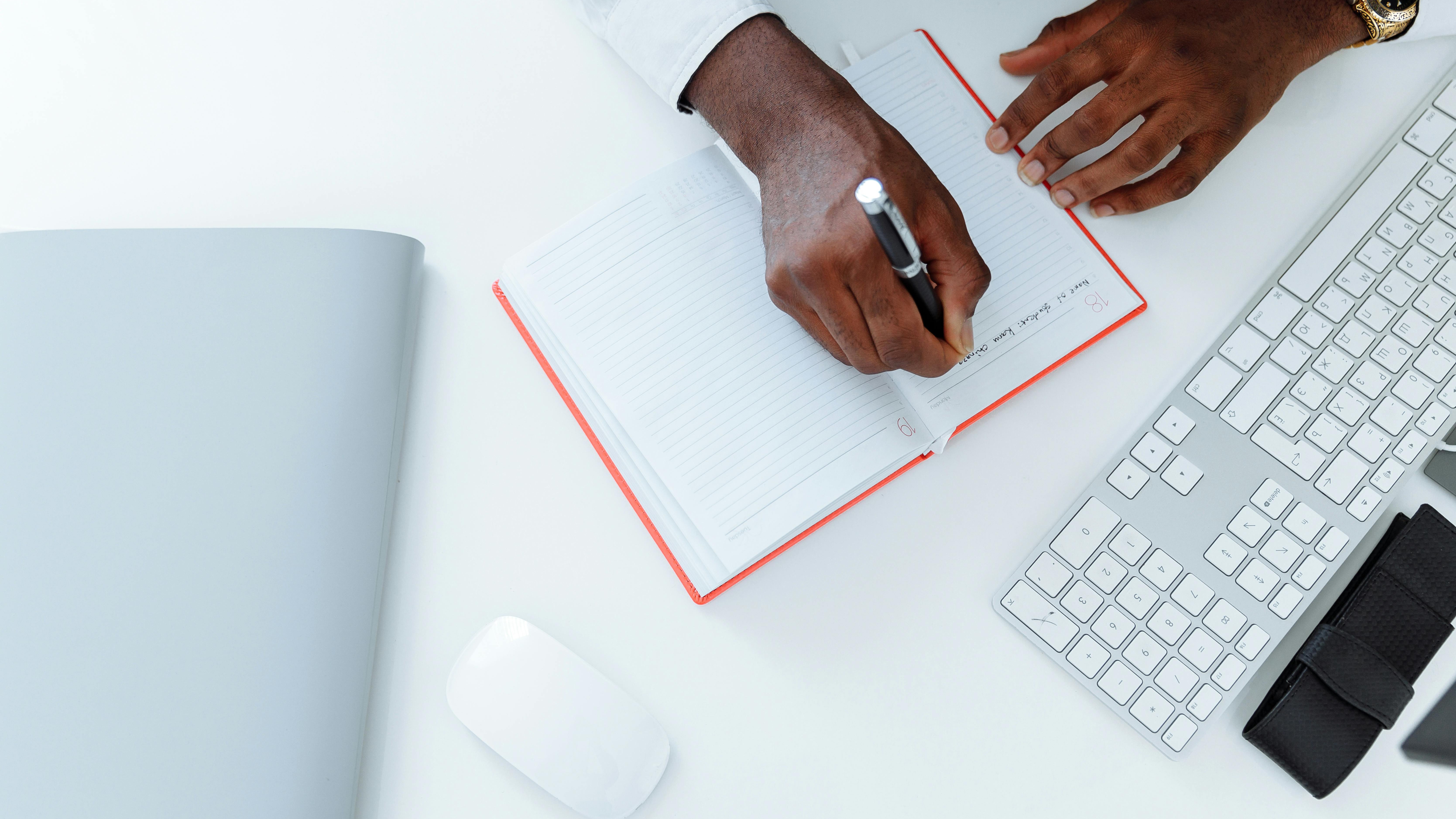 digital tax filing, confident professional, typing, photorealistic, desk with multiple monitors, highly detailed, coffee mug and post-it notes, warm lighting, captured with 50mm lens