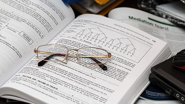 single investor, focused expression, managing retirement investments, photorealistic, sleek office with high-tech devices and large monitors, highly detailed, stocks and graphs on screens, 24mm lens, high contrast colors, overhead LED lighting