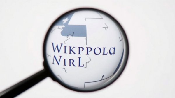 Wikipedia logo under magnifying glass, highlighting exploration.