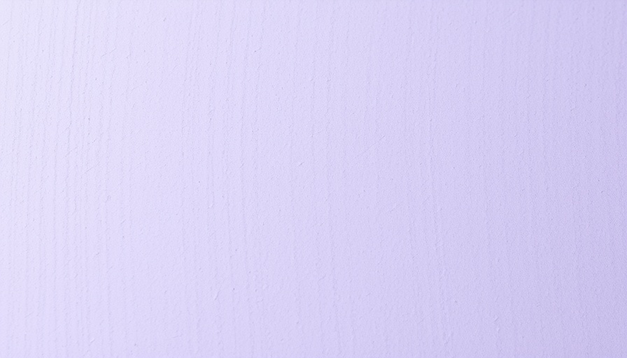 Lavender-stained particle board, close-up texture detail.