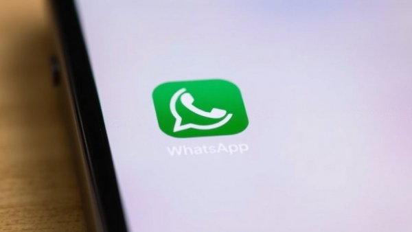 WhatsApp icon close-up on smartphone screen.
