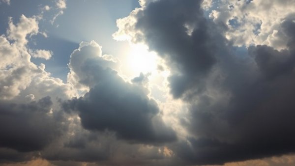 Cloudy sky with sun peeking through, illustrating security vulnerabilities concept.