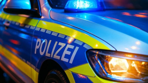 Close-up of POLIZEI lettering on German police car.