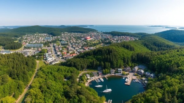 Aerial view of coastal town with lush greenery for Reef Retreat 2026.