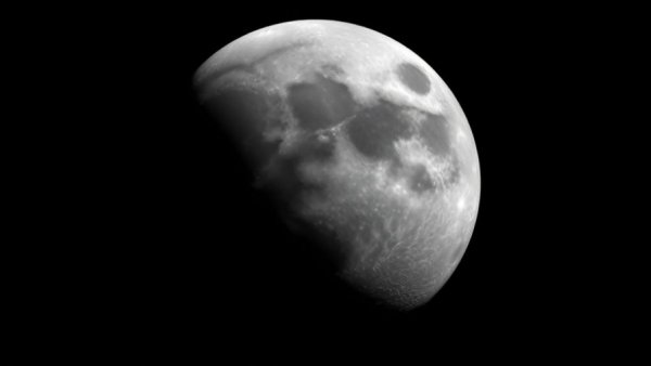 Photorealistic crescent moon with visible craters against dark sky depicting a future site for NASA's Permanent Moon Base.