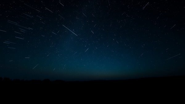 Lyrid Meteor Shower April 2026 illuminating the night sky.