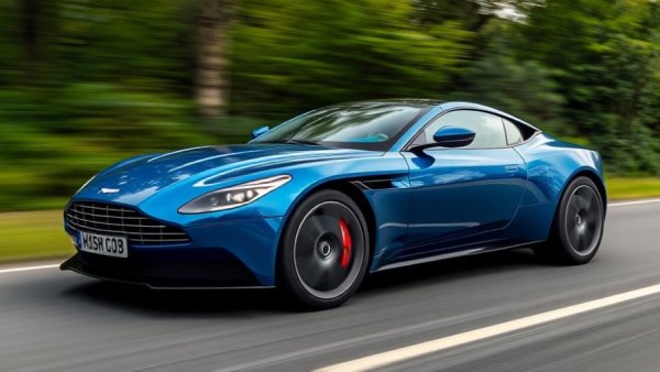 Sleek Aston Martin DB12 S enhancements driving on a scenic road.