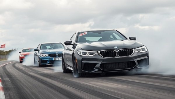 BMW M cars showcasing Ignite technology on racetrack