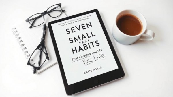 Ebook cover with glasses, coffee, notepad.