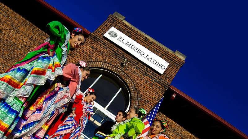 El Museo Latino Omaha renovations showing traditional attire and musicians.