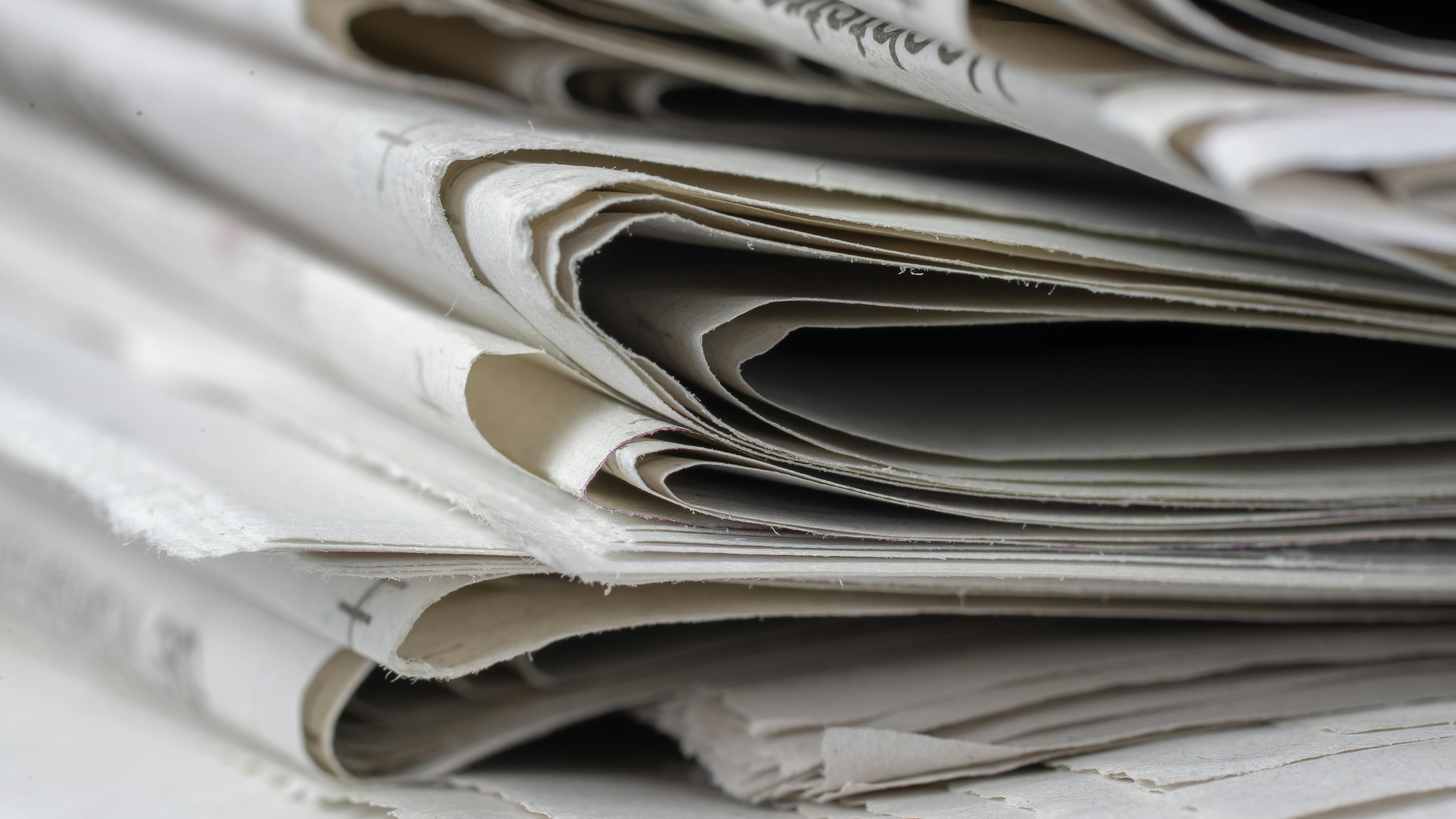 High-speed newspaper printing press in action in Omaha, Iowa.