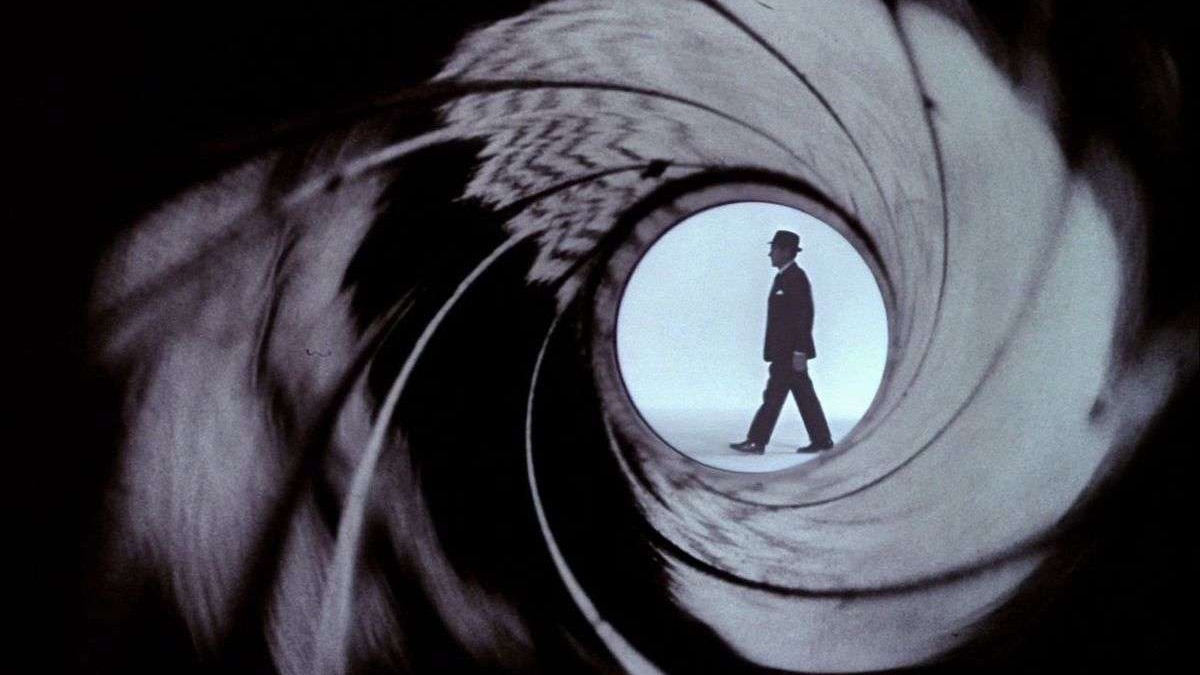 Stylized secret agent poised within a gun barrel frame, future of James Bond video games.