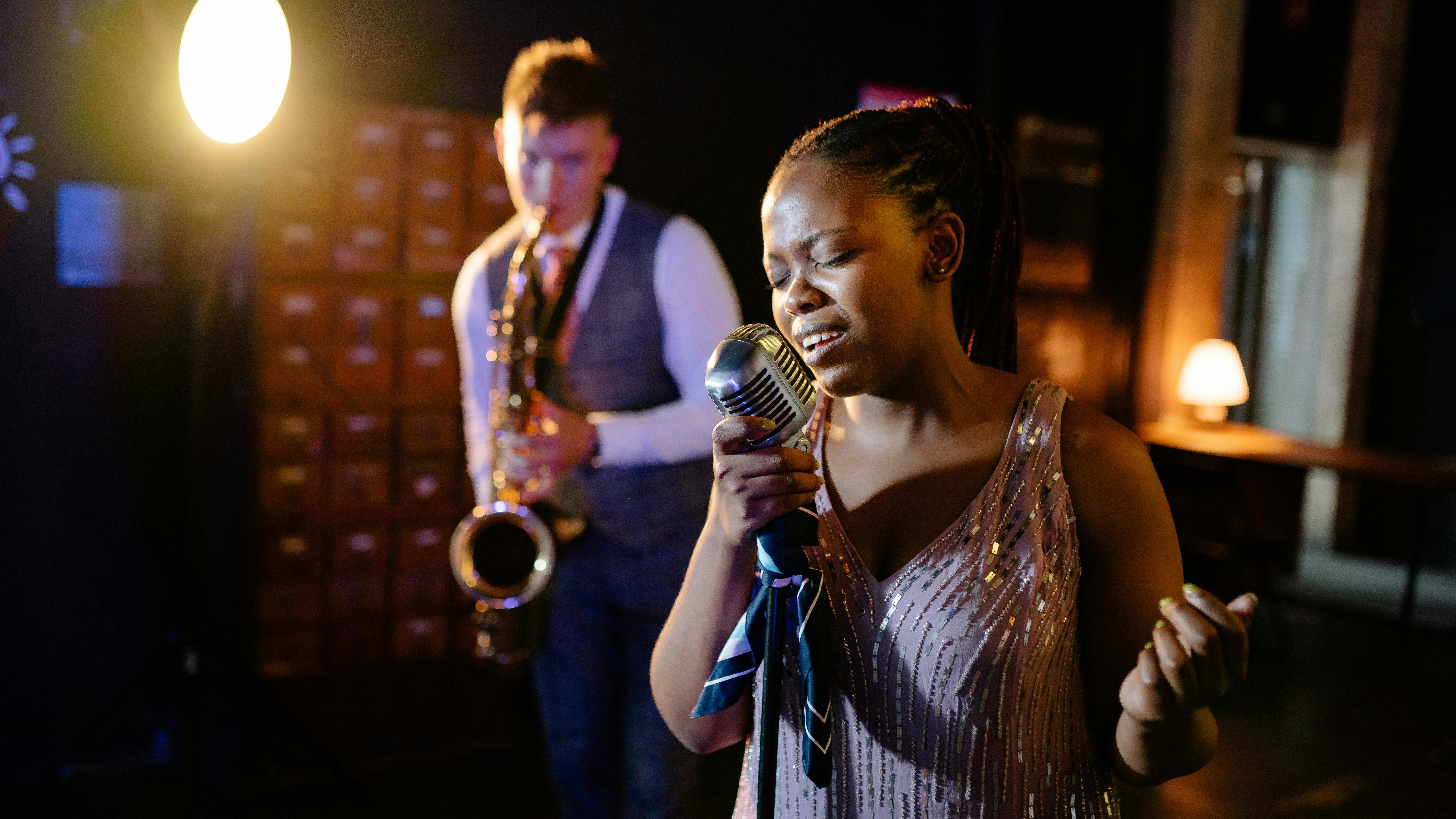 Portrait of a man in black outfit, focused expression.
