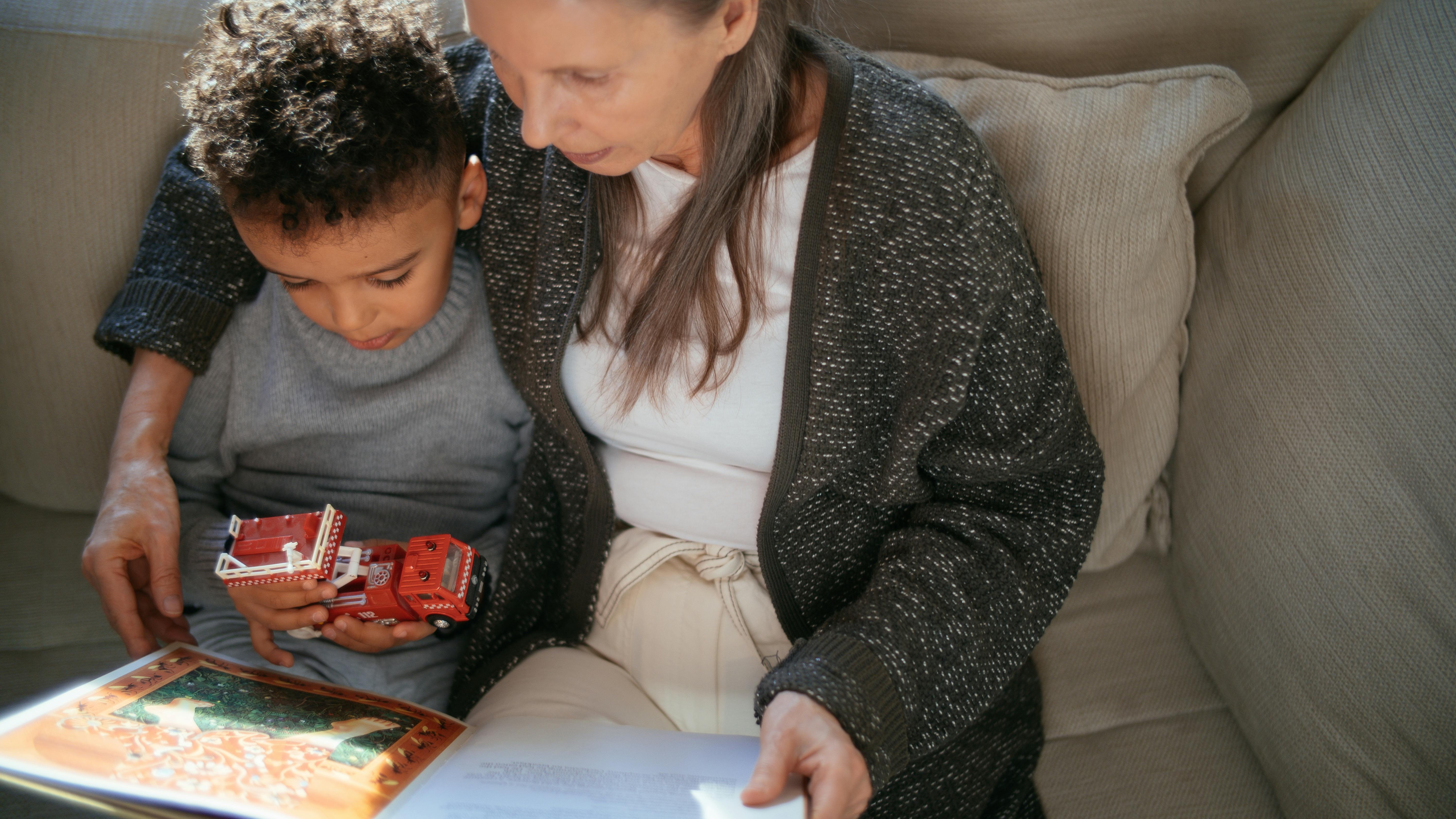 Young child enjoying early learning activities on a tablet.