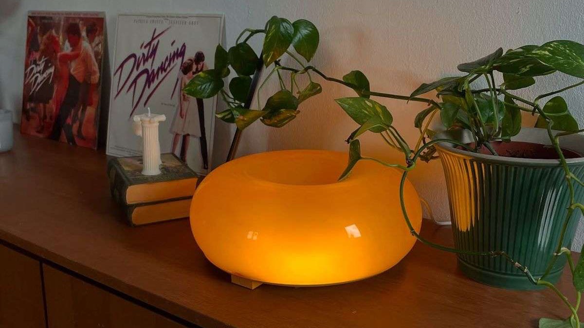 Colorful smart lighting designs with neon strips, glowing tables, and lamp.