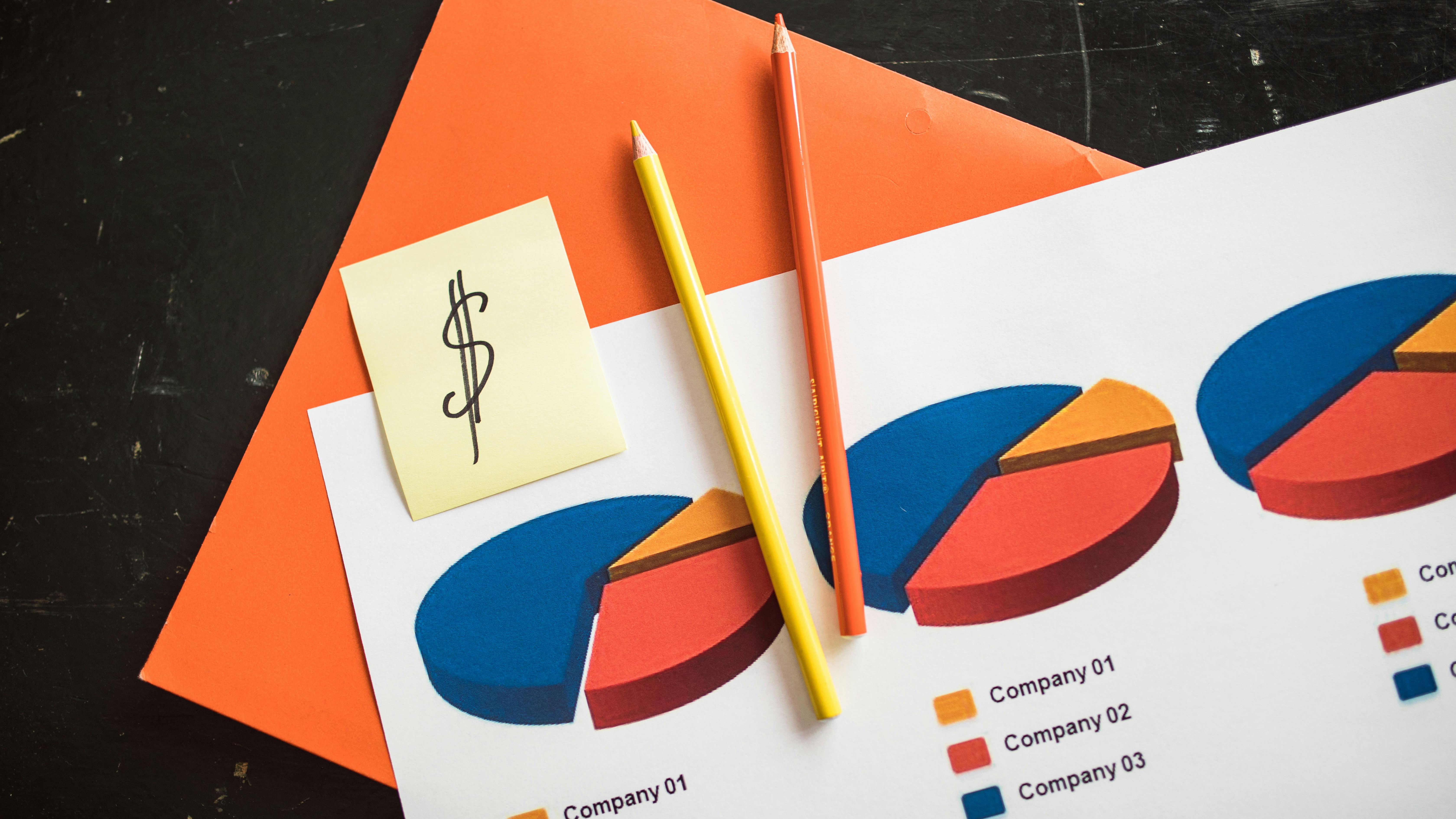 Pastel blocks tipping over against pink background, metaphor for business growth.