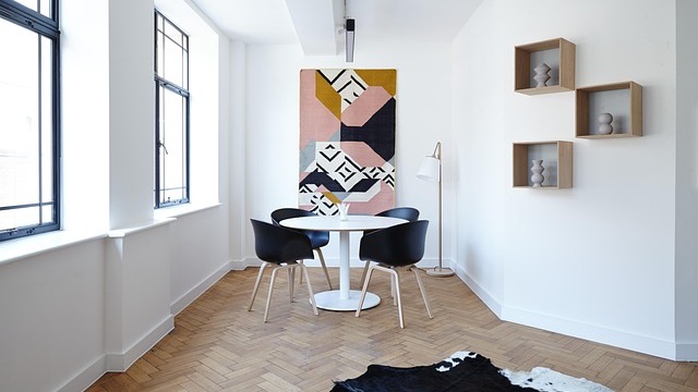 Elegant coastal carriage house interior with modern furniture and decor.