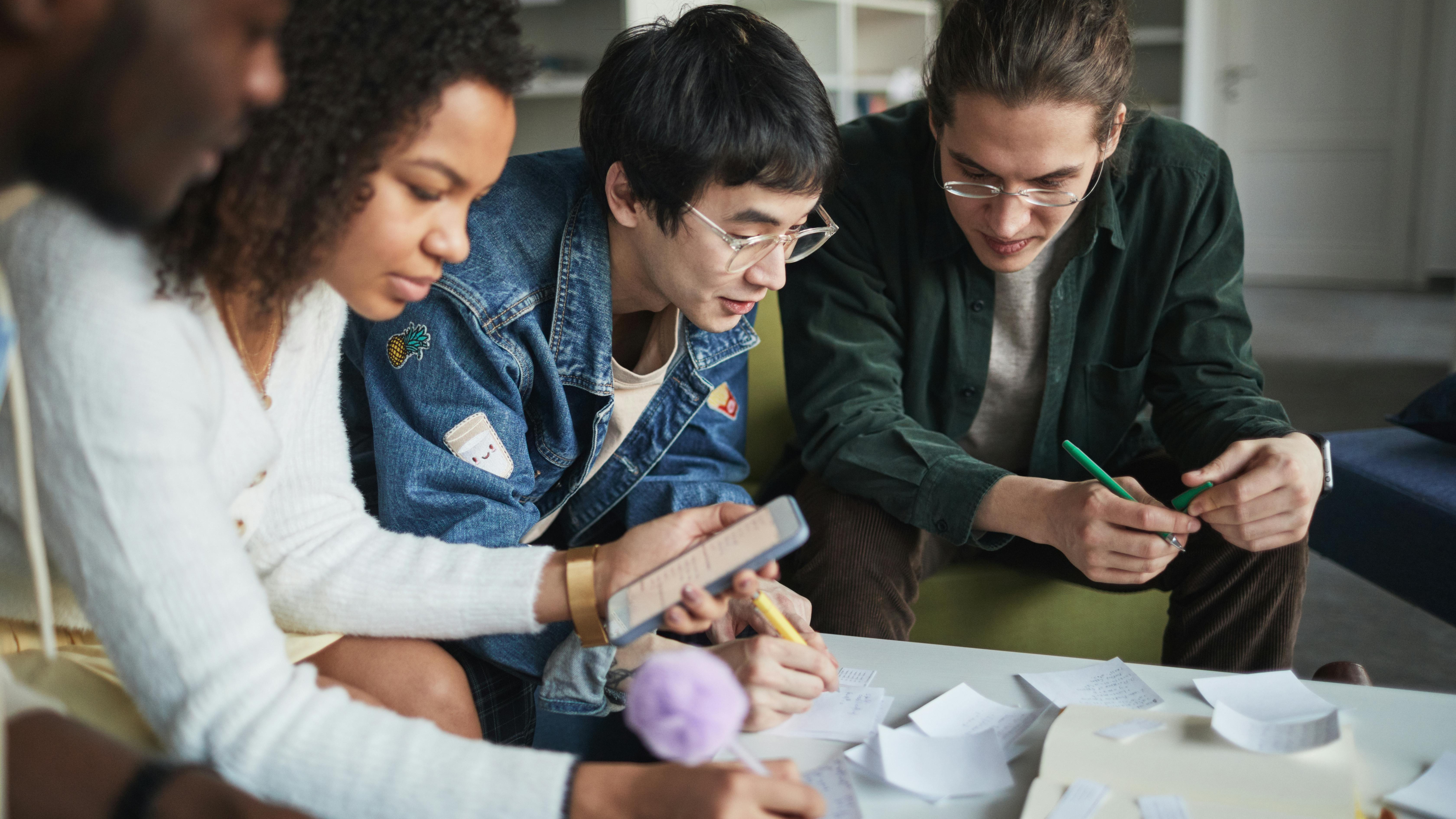 Gen Z and mentor collaborating on electrical panel, workplace learning