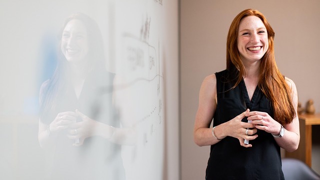 Radisson hotel's exterior showcasing outdoor seating and garden.