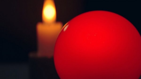 Candlelight Tribute to Fleetwood Mac promotion with red sphere.