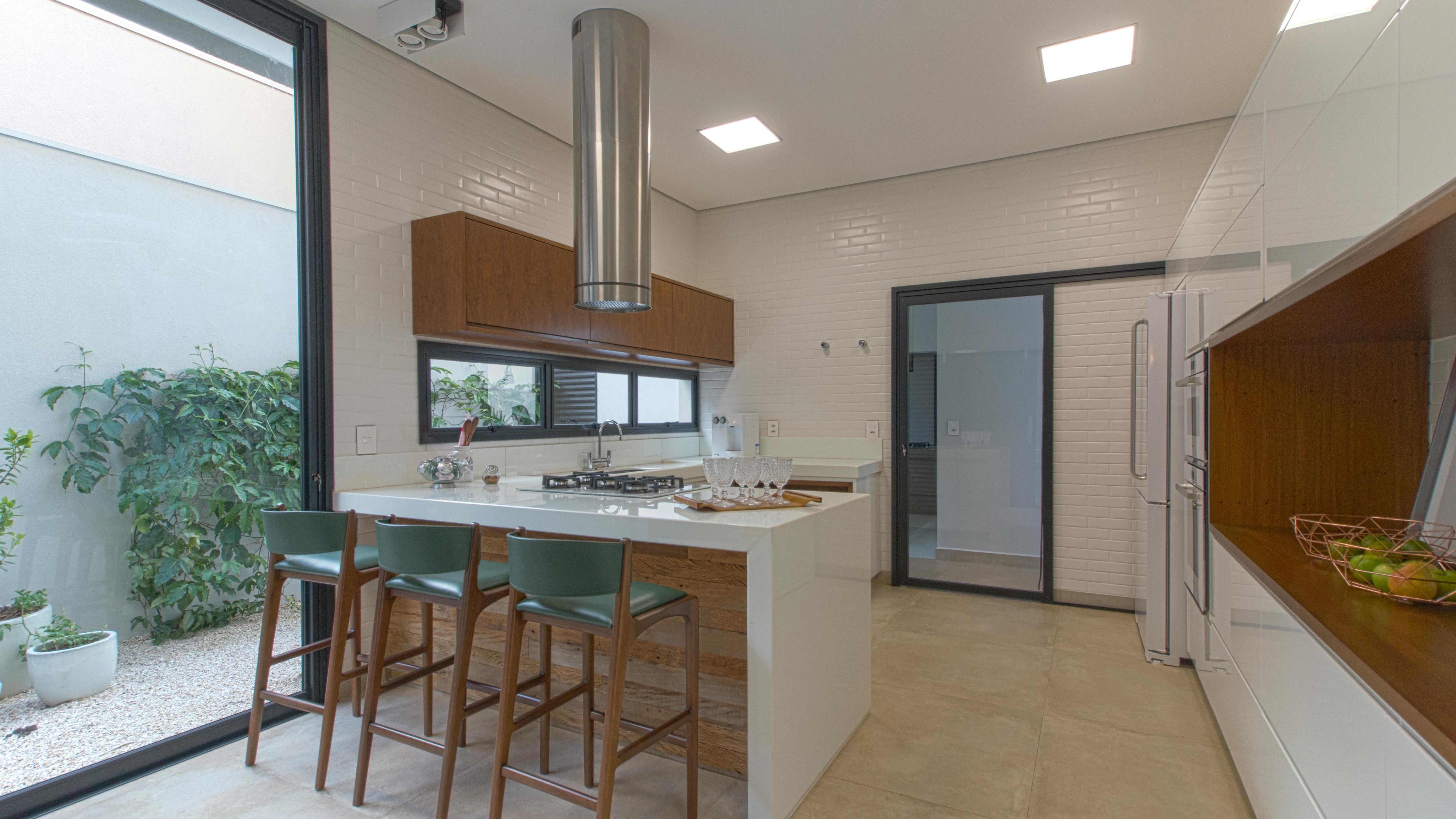Traditional kitchen with white cabinets and wooden elements.