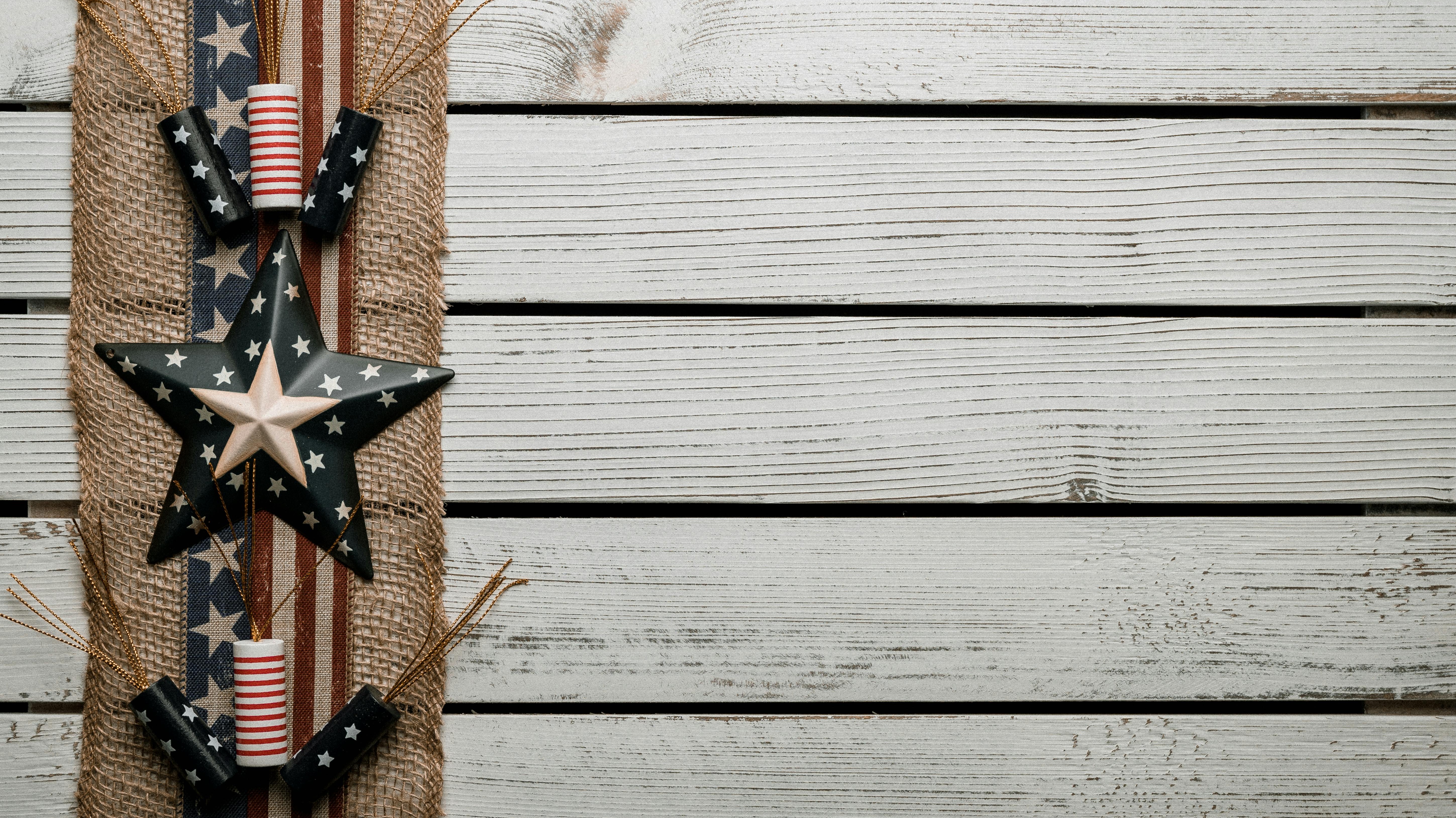 Festive outdoor table with Fourth of July decoration ideas, red and white florals.