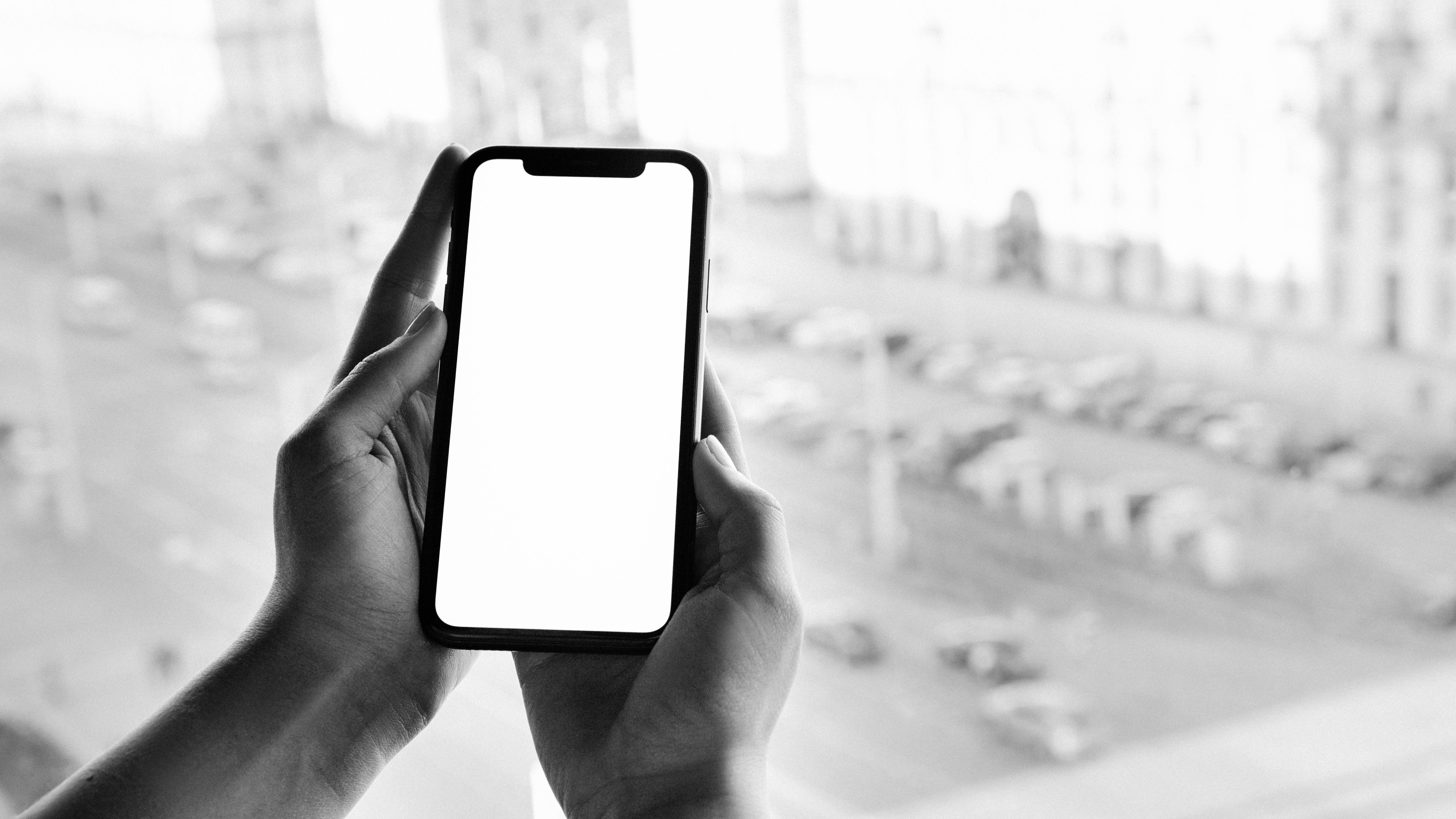 5G Rollout in India: Hand turning a mobile network dial set to 5G.