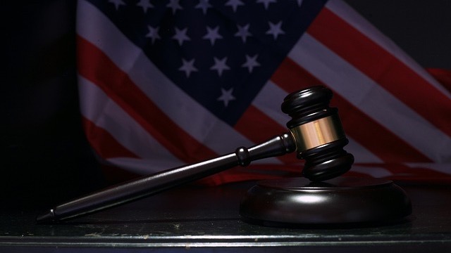 Minimalistic logo design against a blue background.