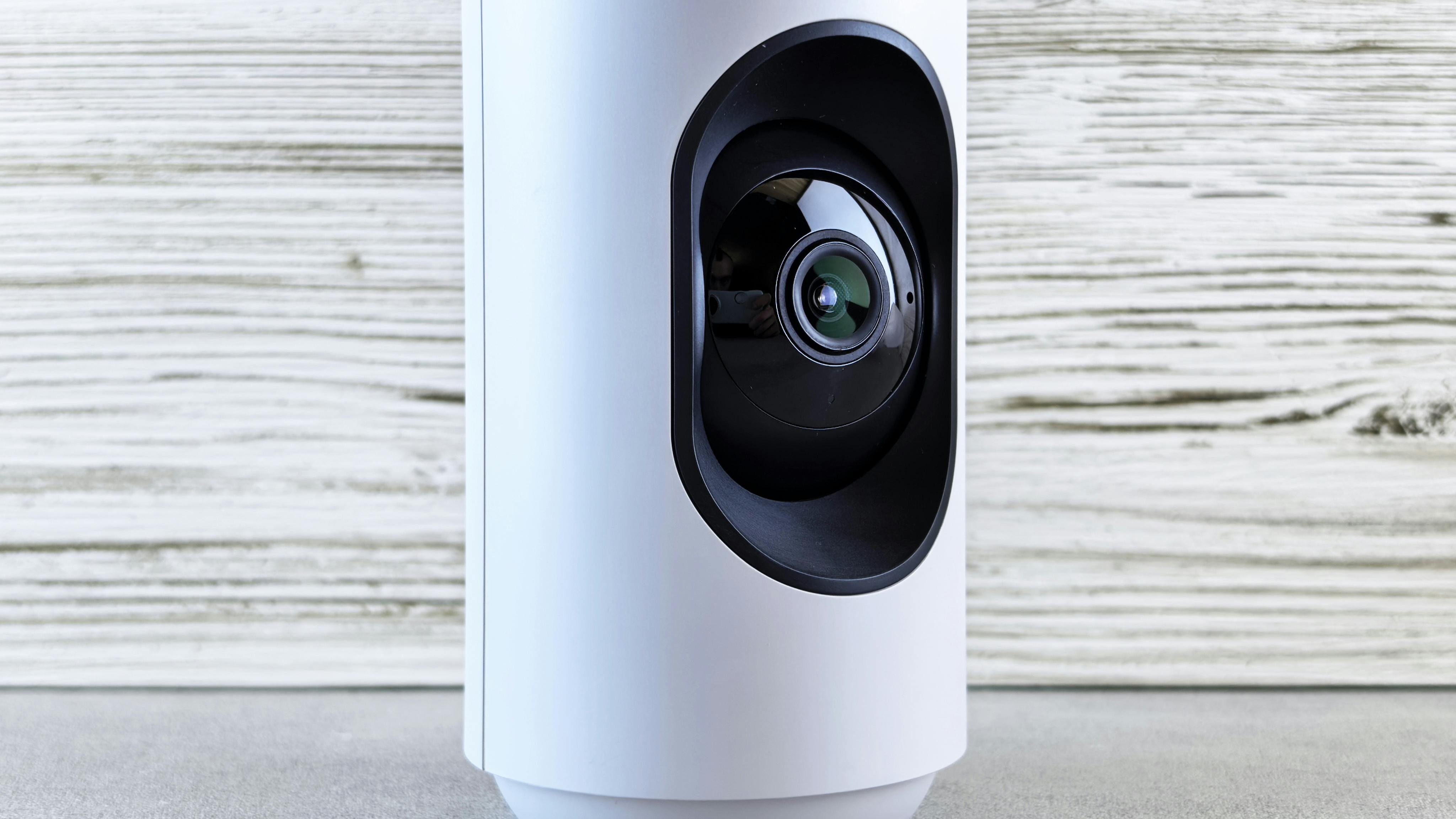 Smart home device displaying commute info on a cozy nightstand.