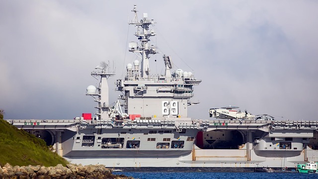 Futuristic military fighter jet on carrier deck, military jobs context.