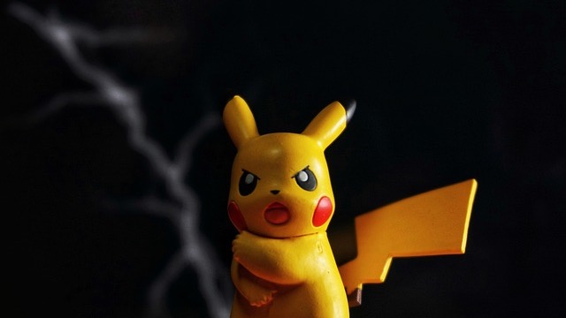Pokémon Deluxe Character Guide hardcover with vibrant background.