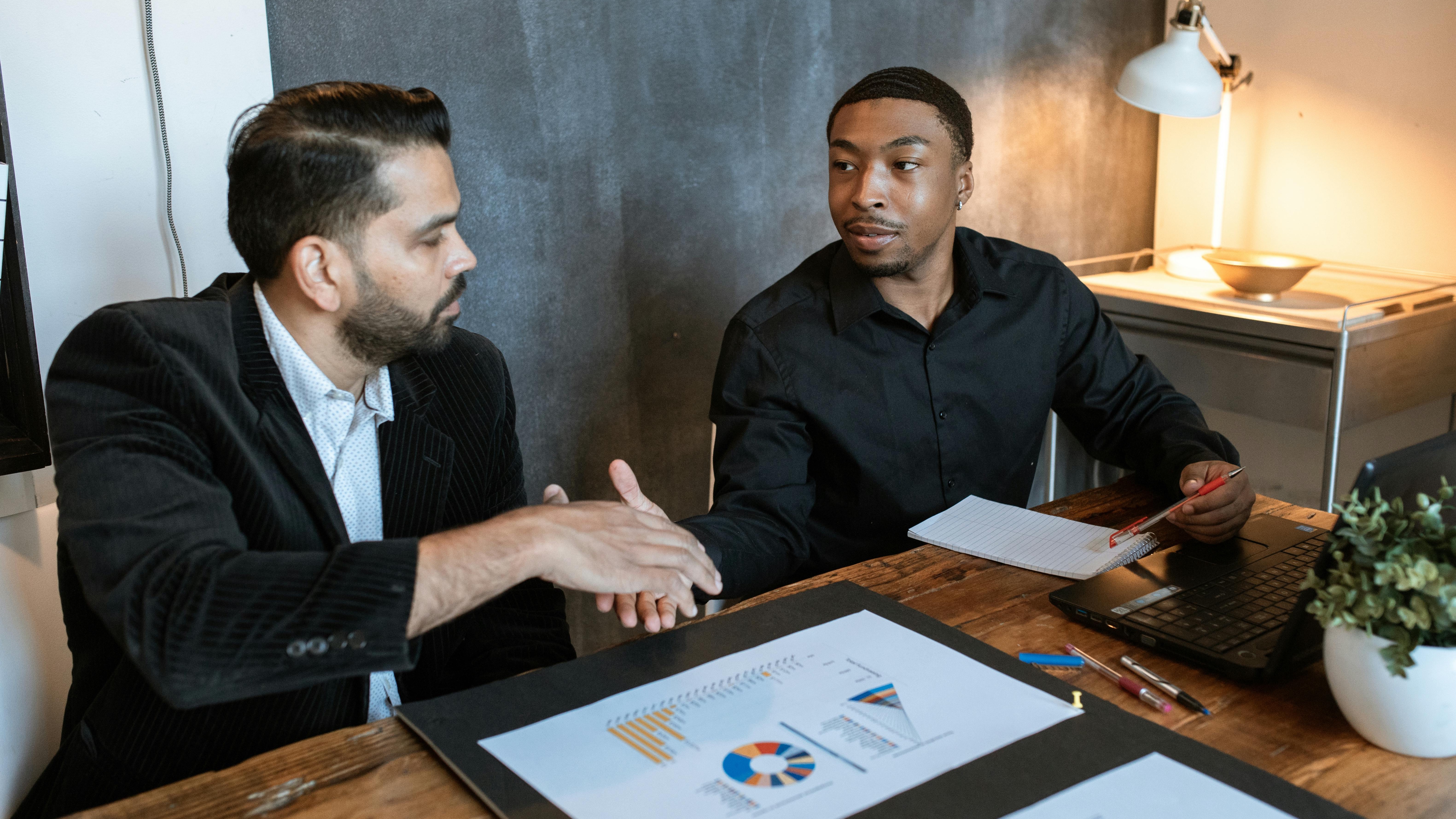 Shadows depicting tense discussion on HR responsibility in leadership misconduct.