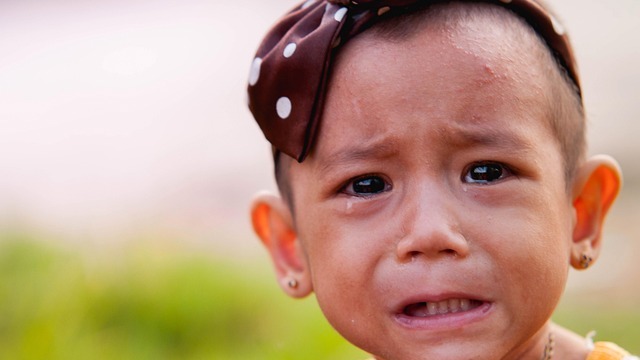 Comforting scene of toddler experiencing separation anxiety.