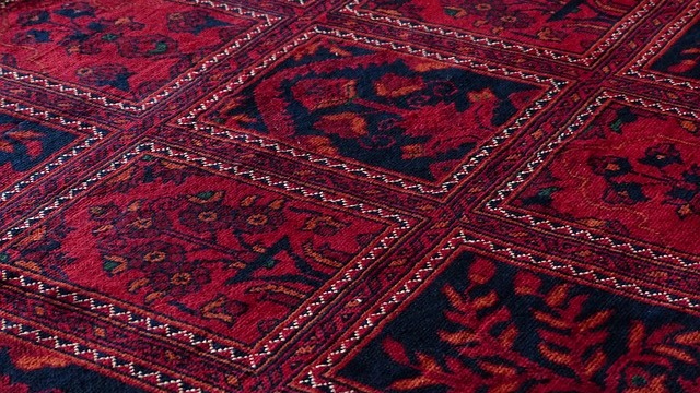 Joanna Gaines’ rugs and pillows sale ad featuring a smiling woman and elegant oriental rug.