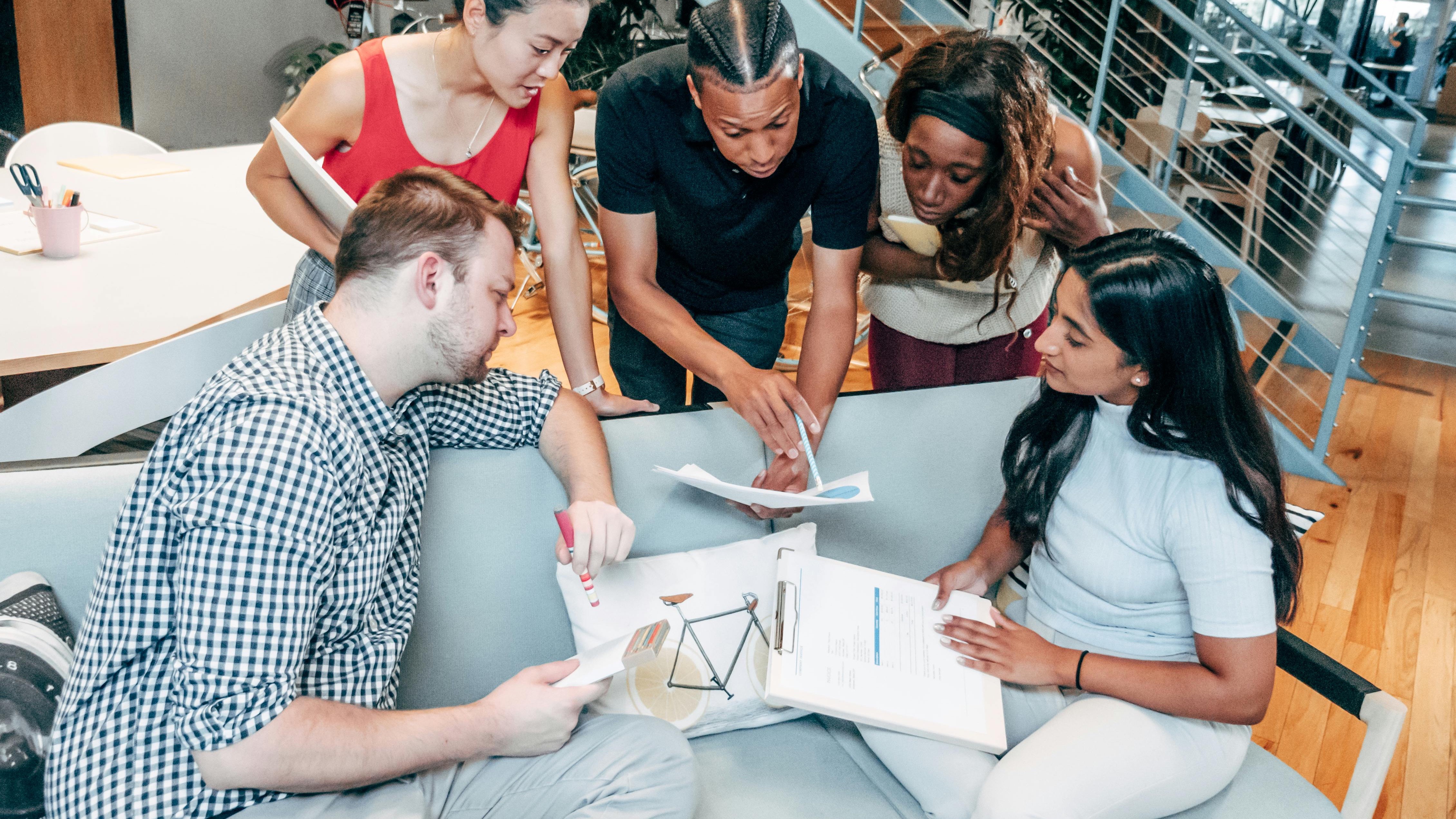 Job promotion banners on a building emphasizing employee retention strategies.