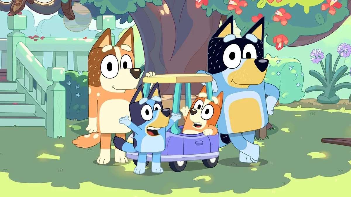 Cartoon dog family enjoying time at the beach, highlighting parenting lessons from Bluey's mom.