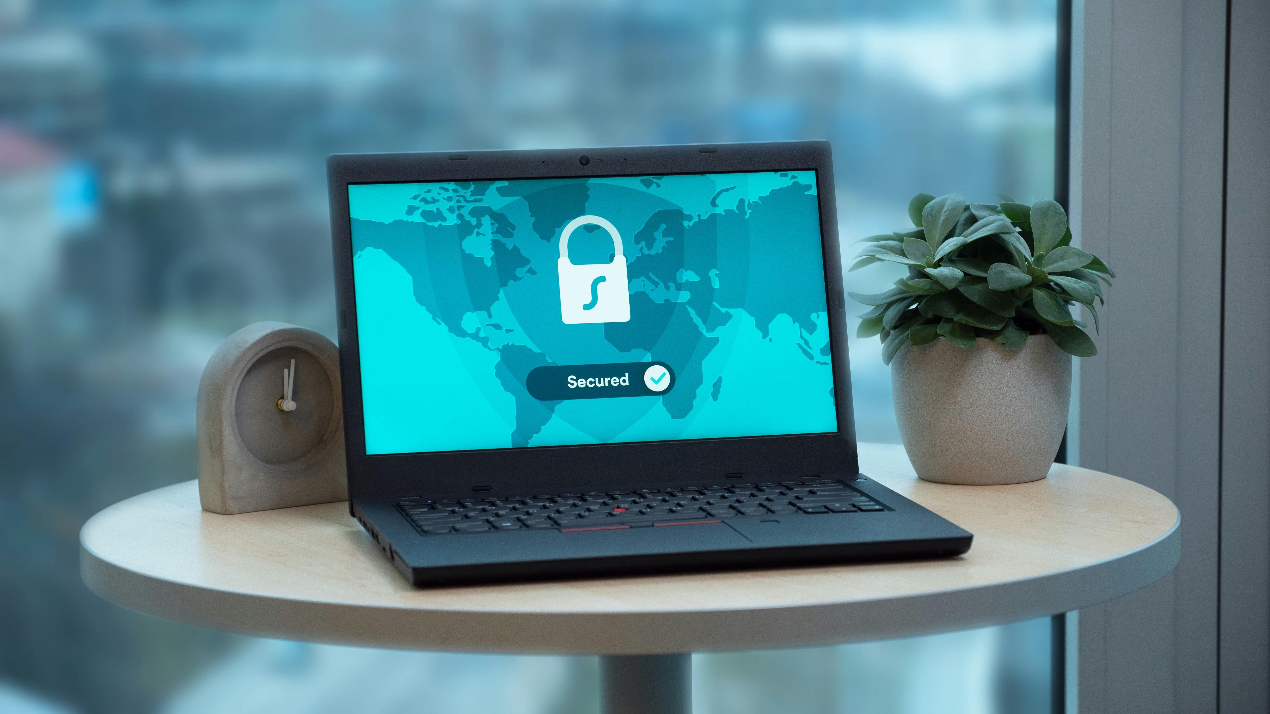 Secure router on table in home office, highlighting FBI router security tips.