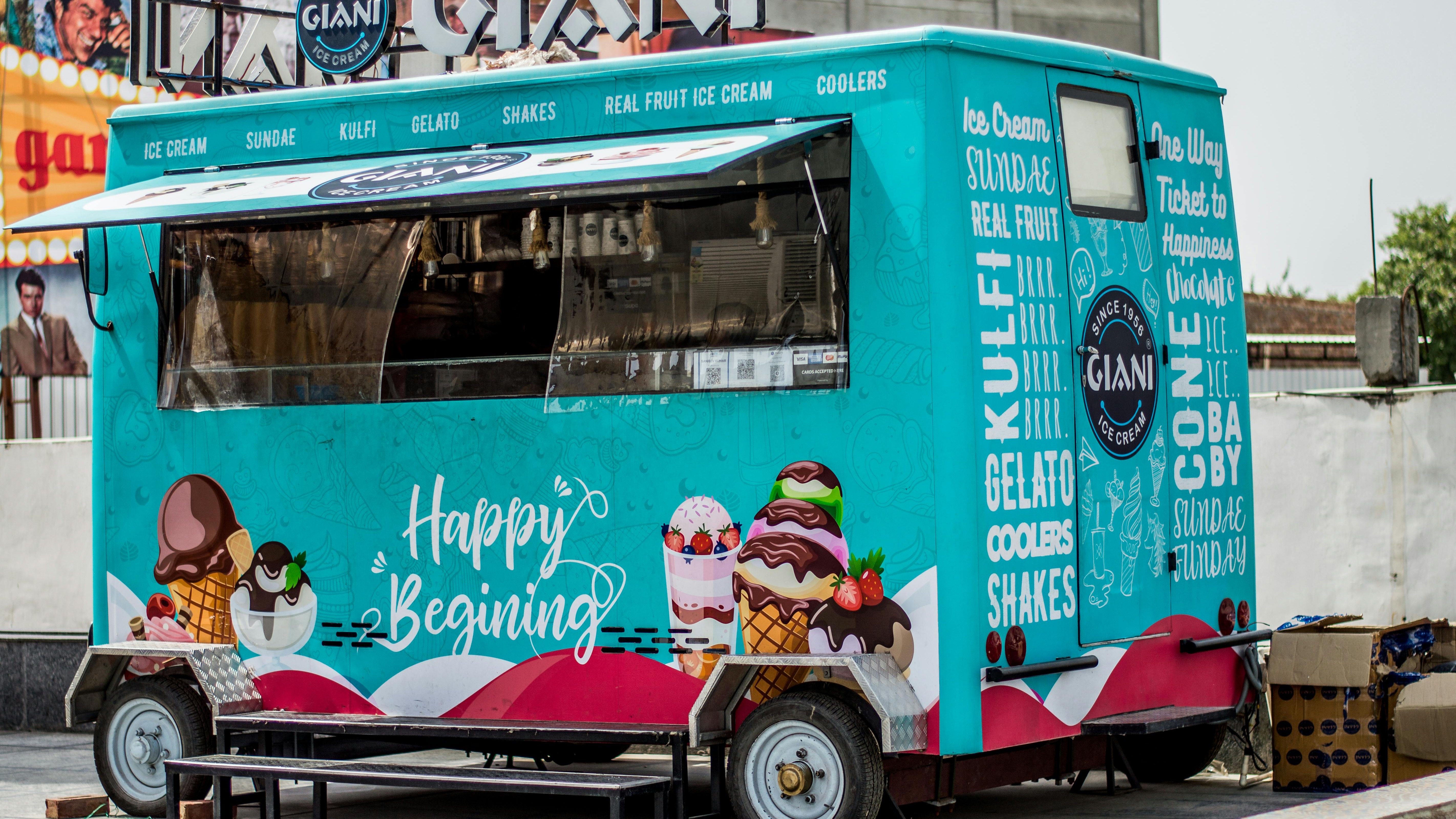 Smiling chef by colorful Texas food truck, vibrant scene.