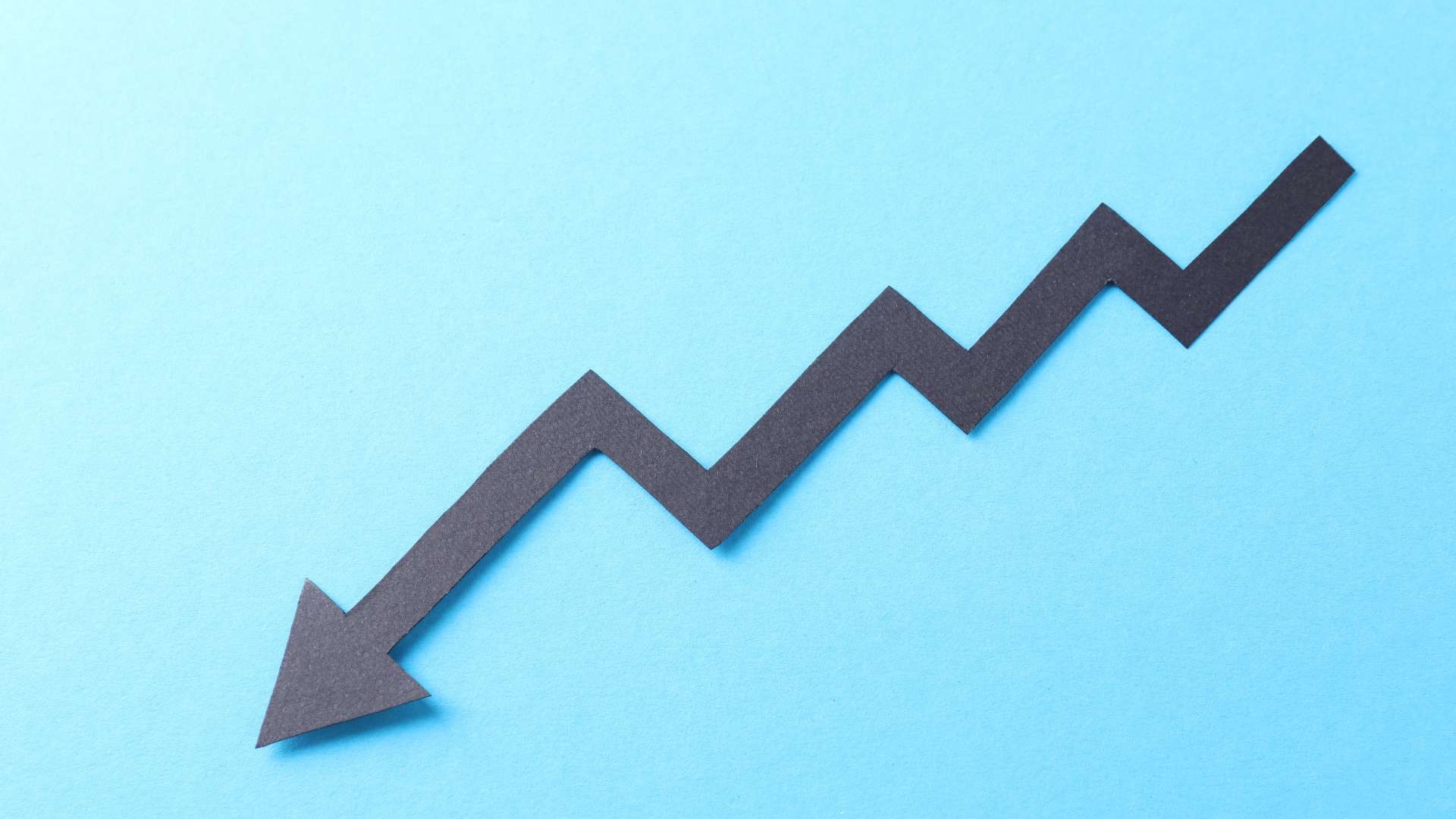 U.S. Employee Well-Being: Attentive young woman with headset in modern office.