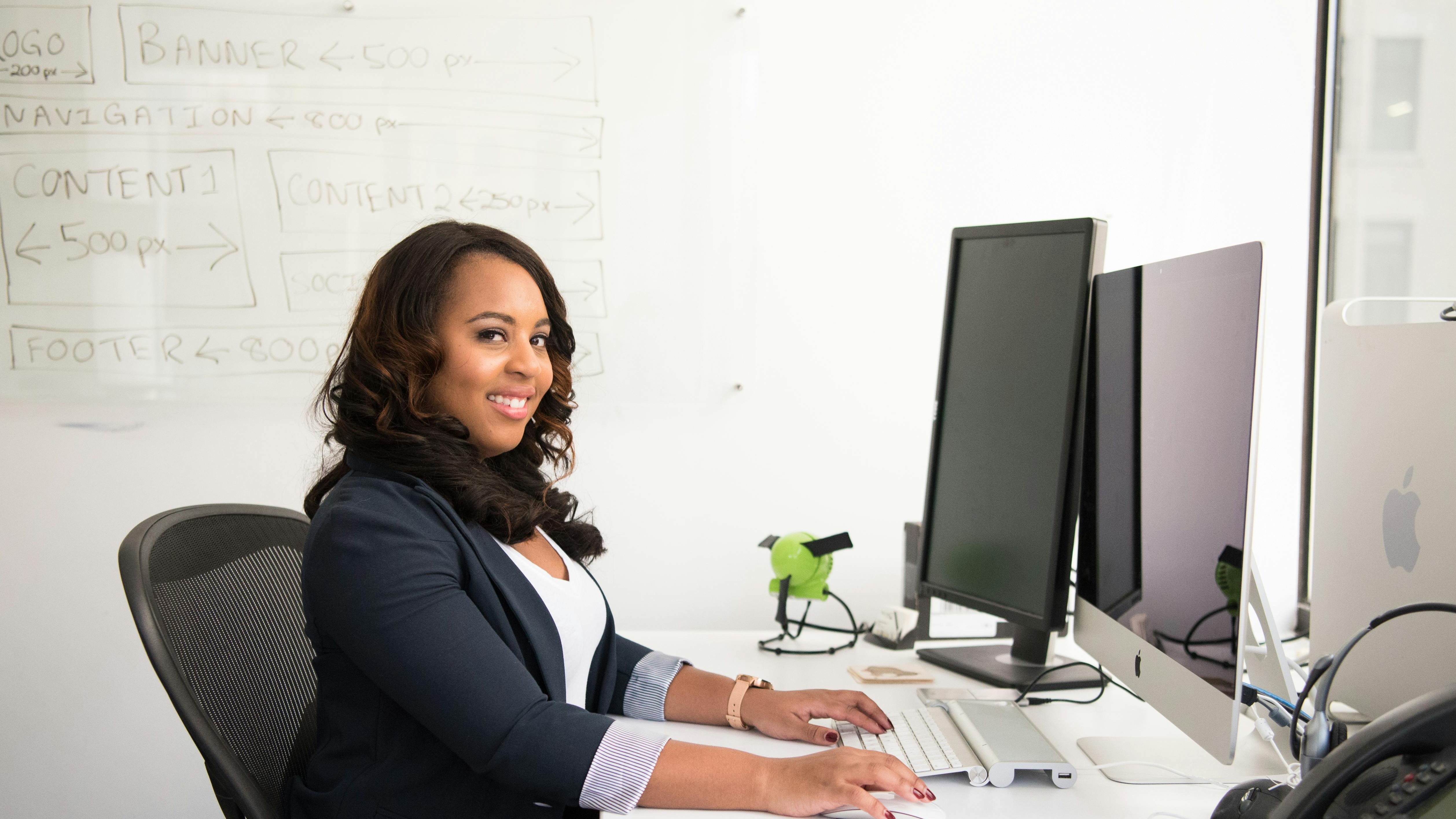 Confident man in office setting related to HR technology.