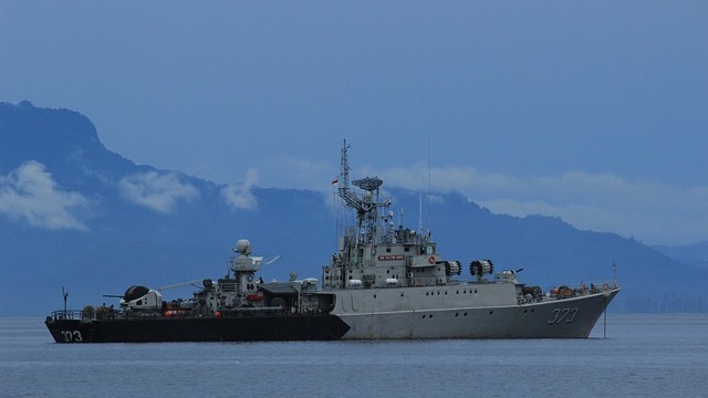 Trump-class USS Defiant warship in action, launching missiles.