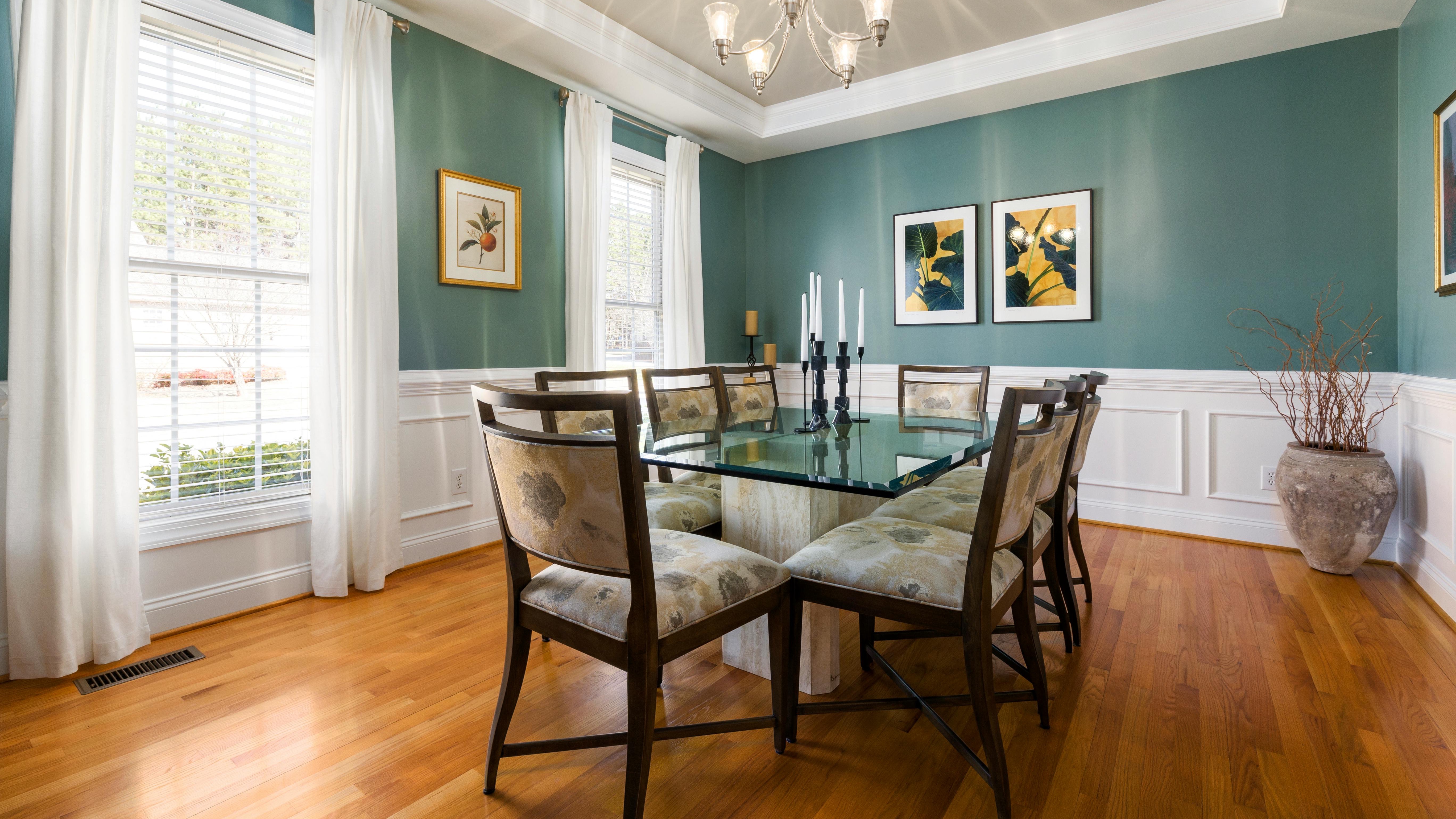 Traditional dining room with outdated features and elegant decor.