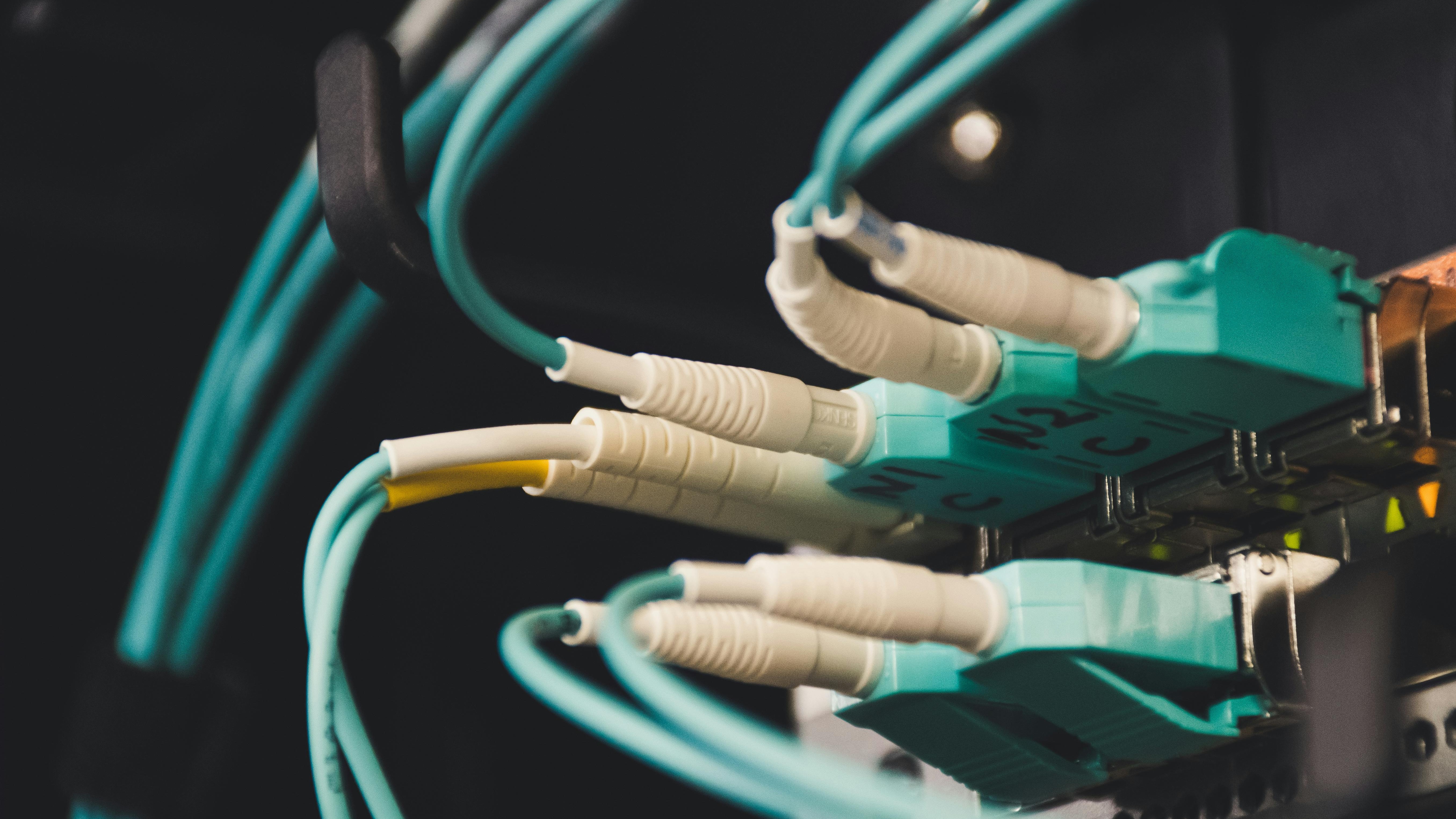 All-fiber network installation with colored tubing outdoors.