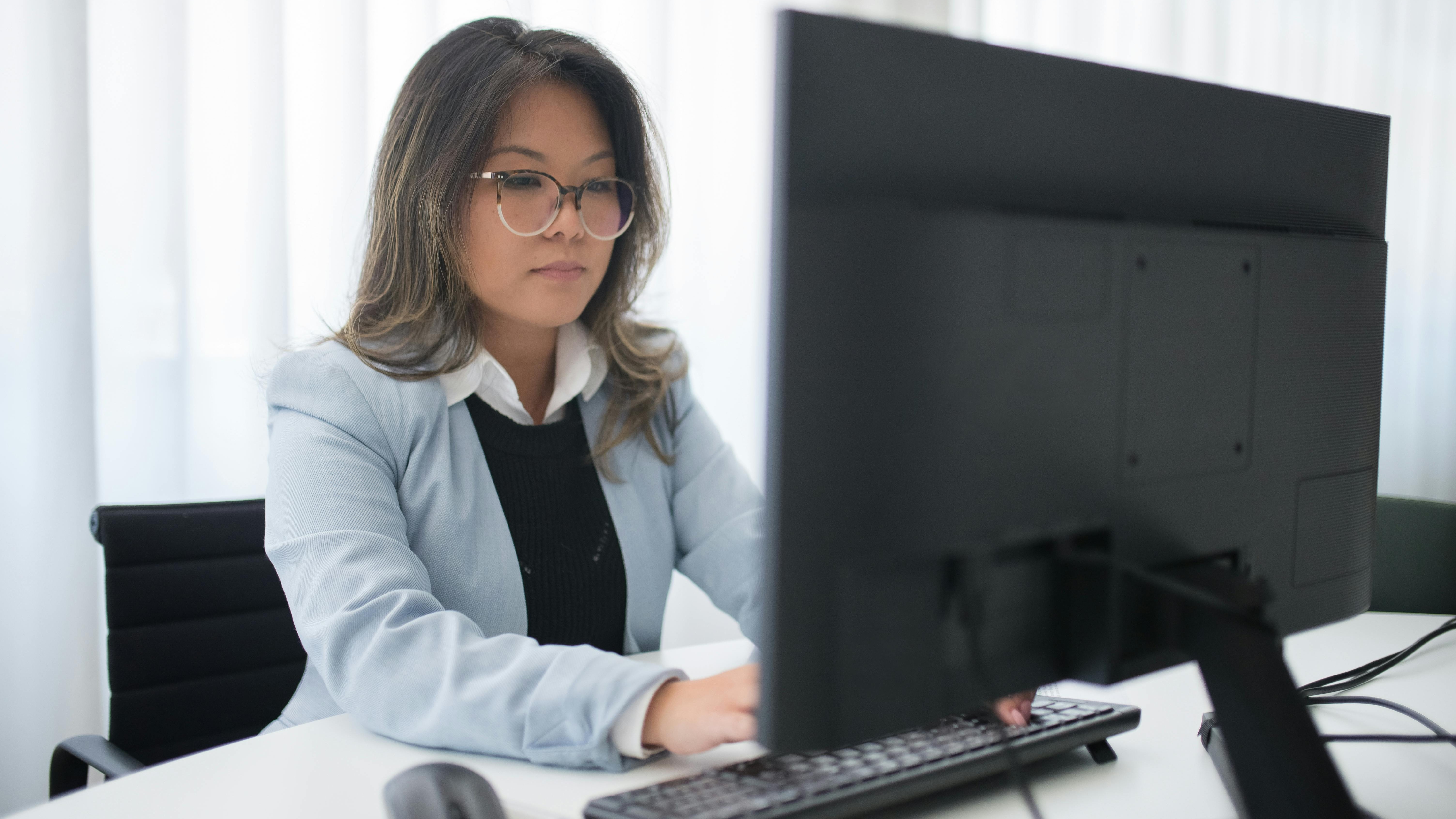 Confident woman in office symbolizes work-life balance in recruitment.