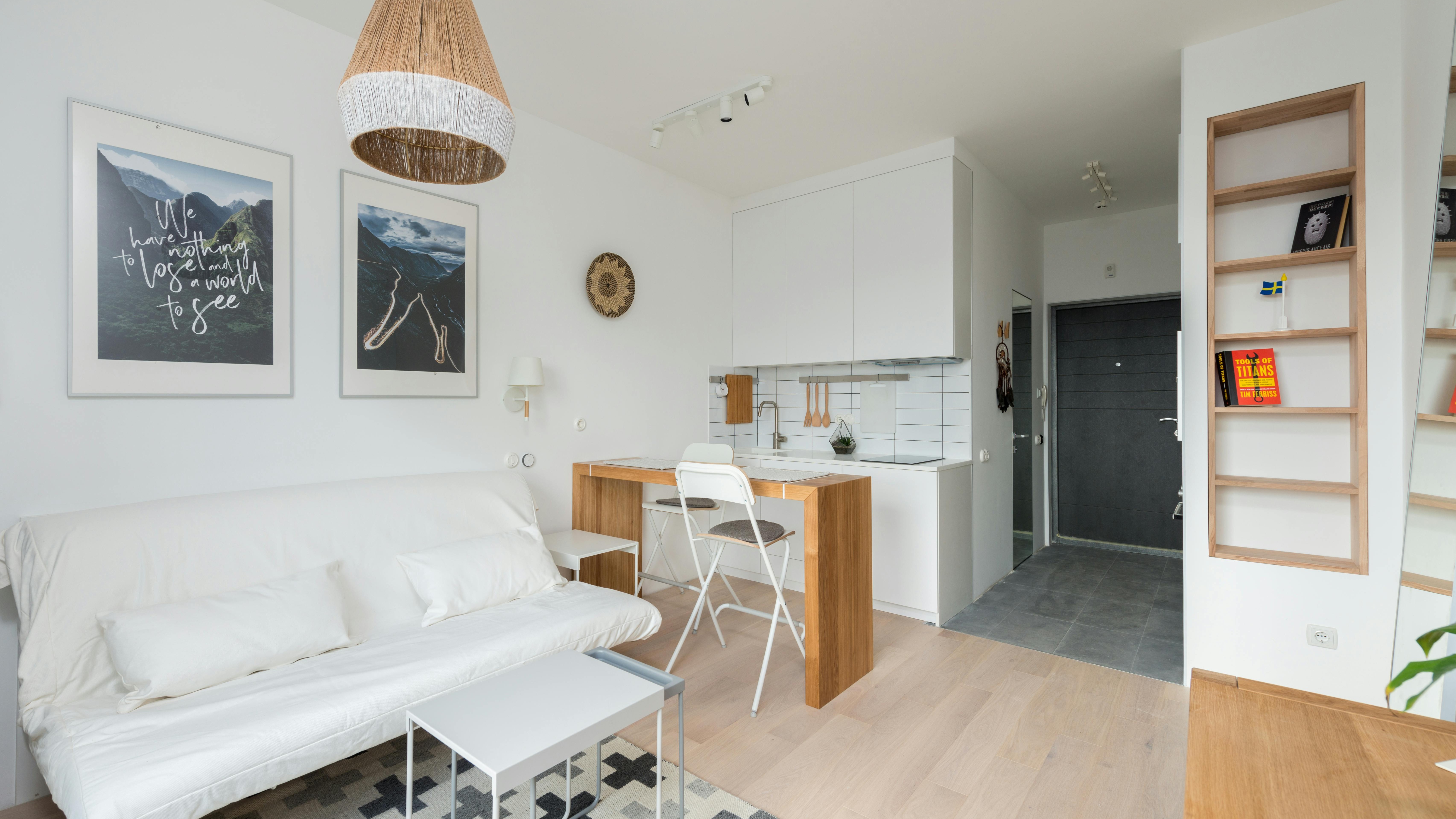 Stylish DIY coat storage cabinet with open doors showcasing denim and boots.