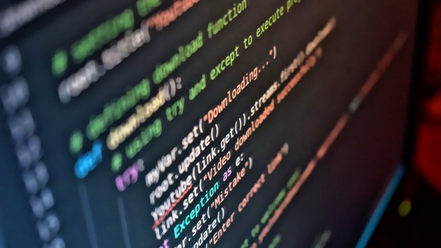 Joyful young men in AI coding startup environment