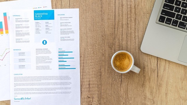 Colorful red pushpin on 'Top 10' note on a green background.