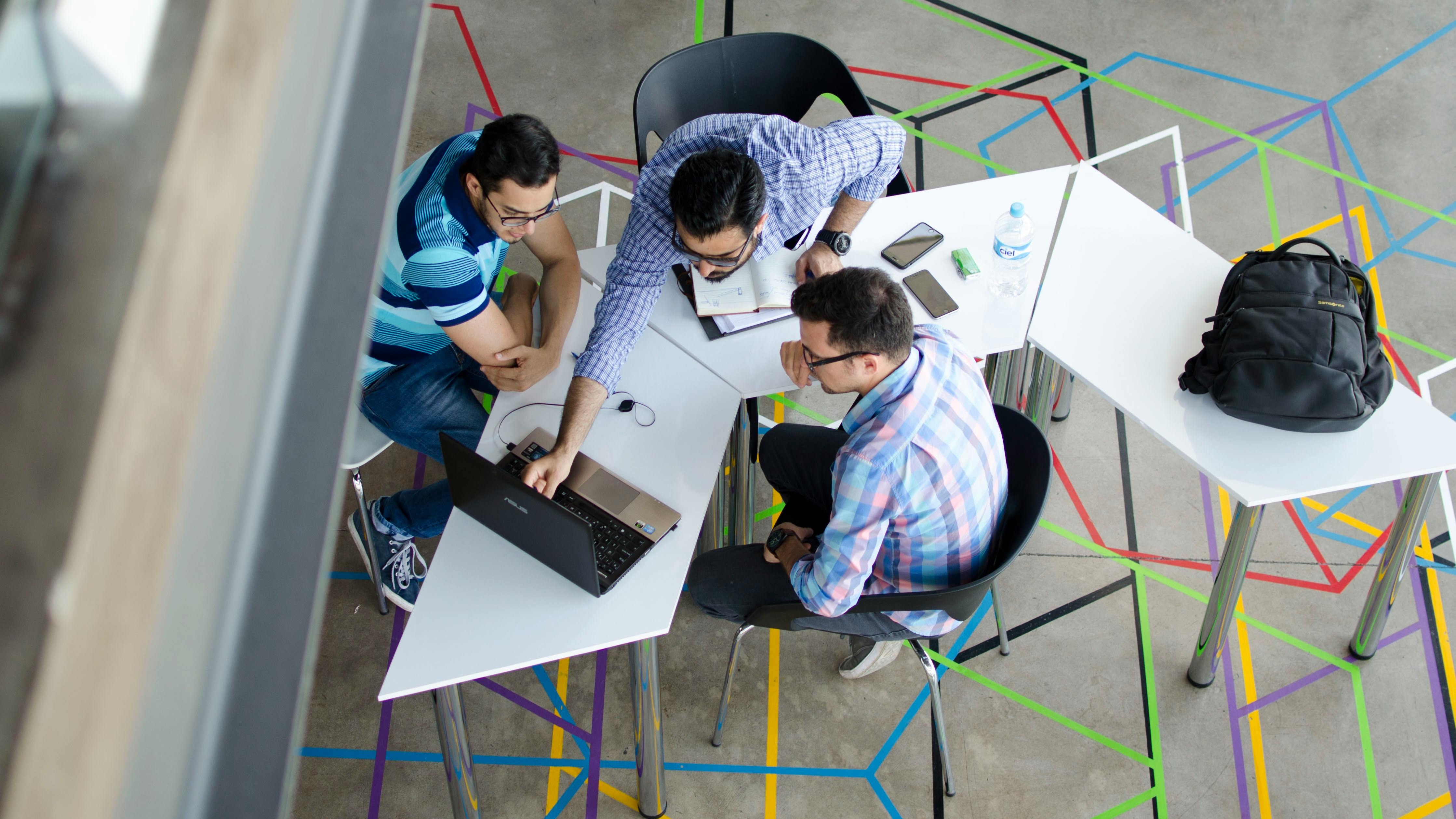 Split-screen desk visualizing merging CHRO and CTO roles.