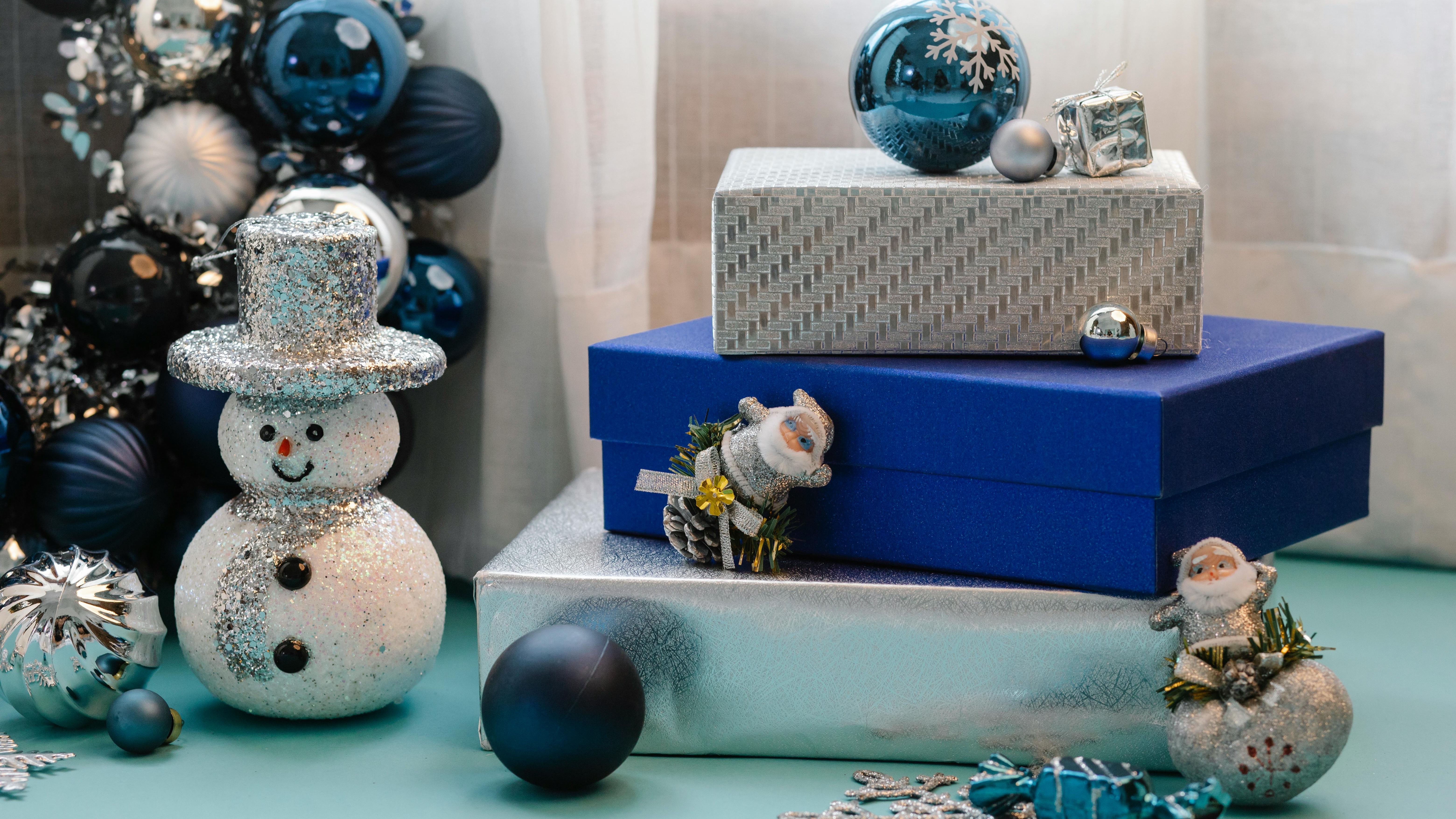 2025 Christmas decor trends Omaha living room design with a fireplace and tree.