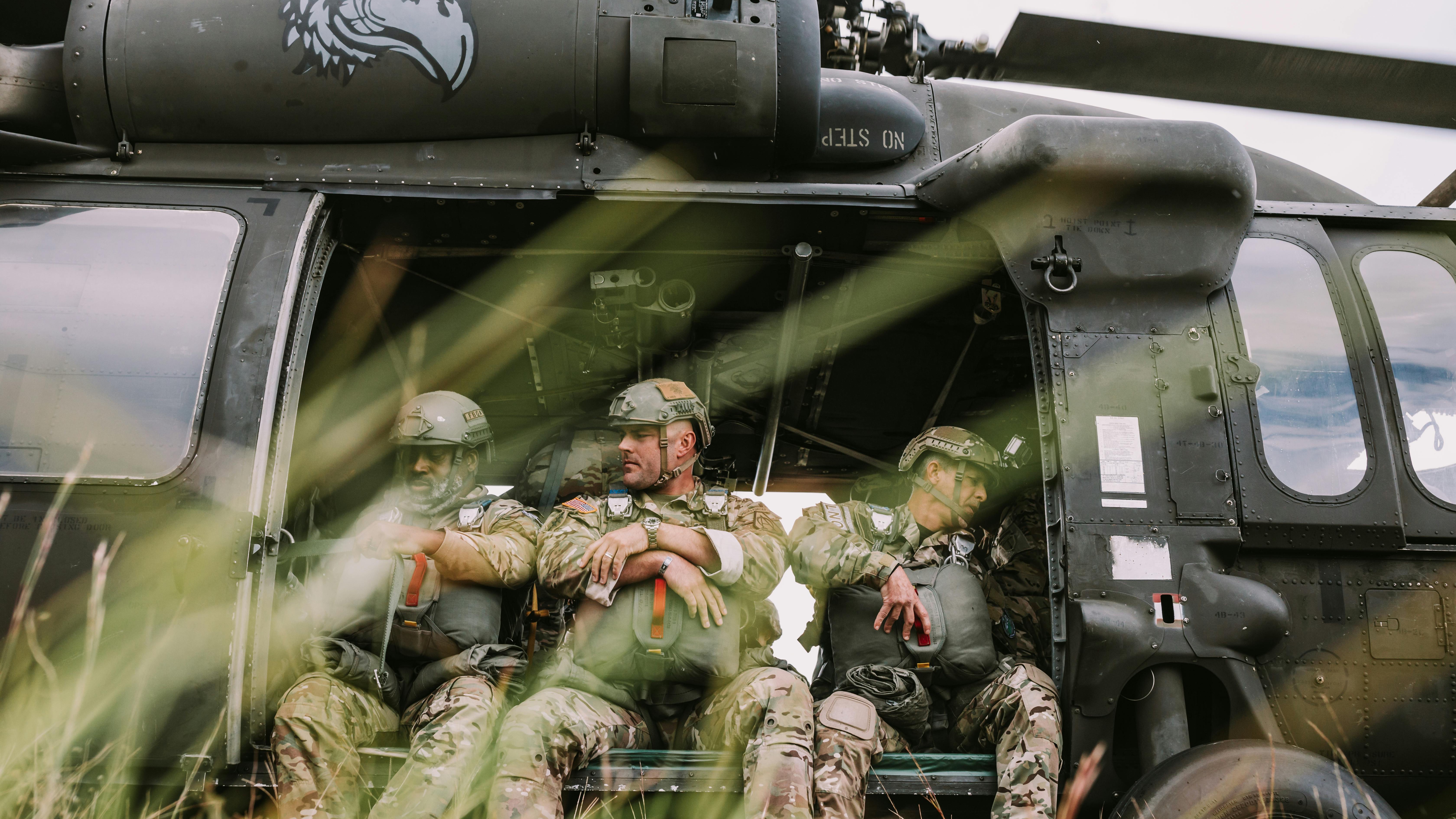 Deployment homecoming reunion, soldier embracing loved one at airport.